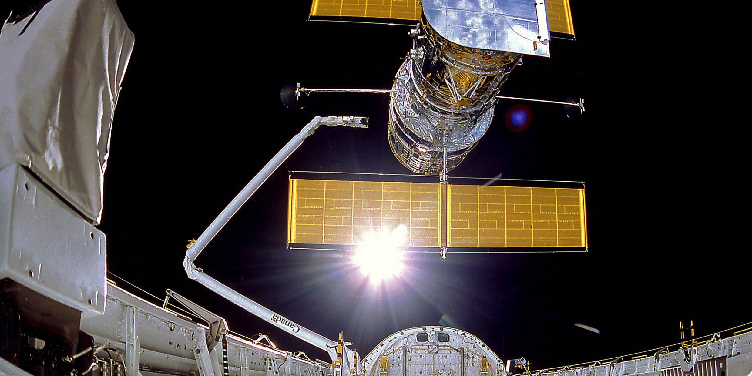 Image of the Hubble Space Telescope being deployed in space