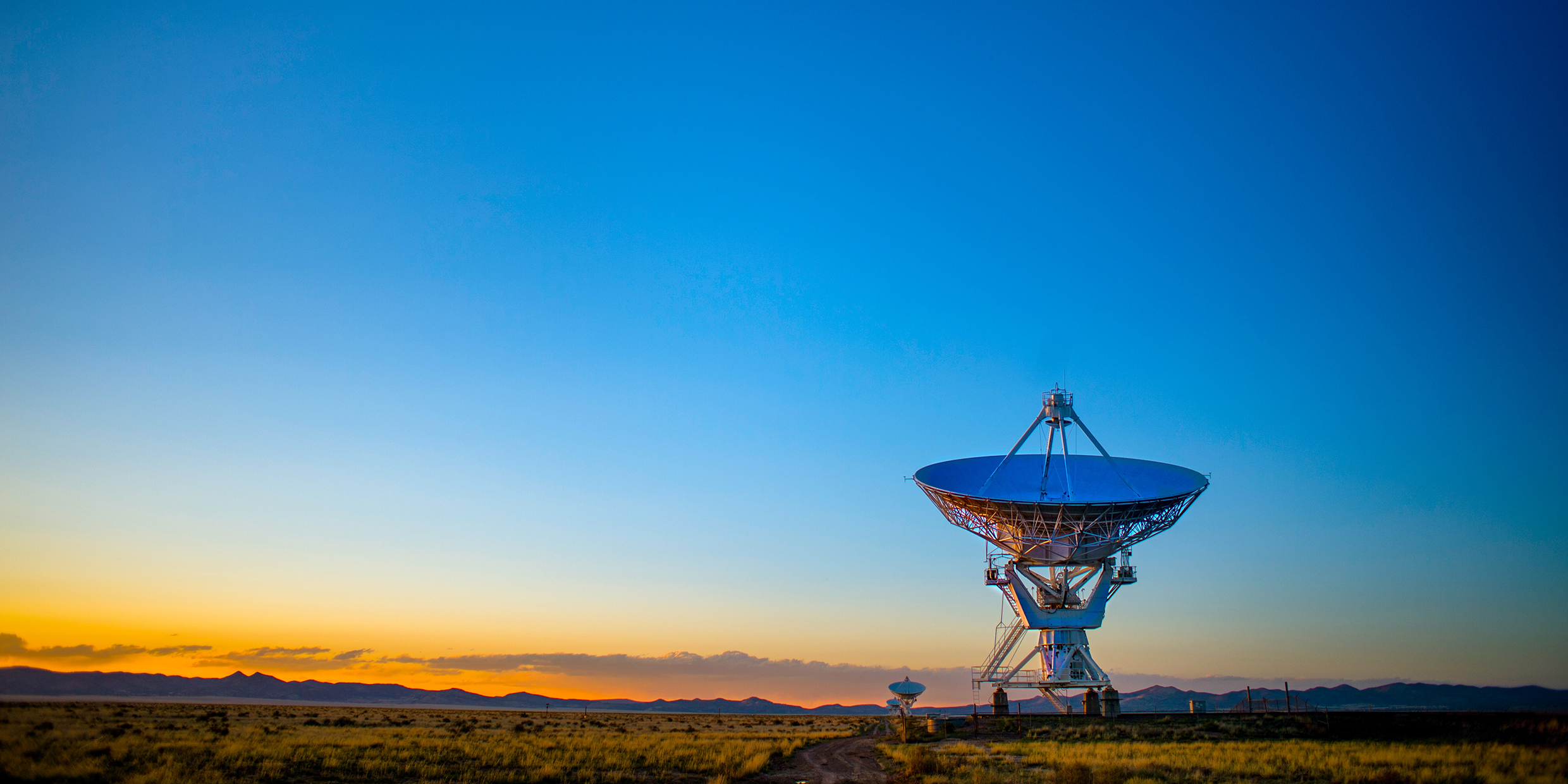 Image of a radio telescope pointed toward the sky