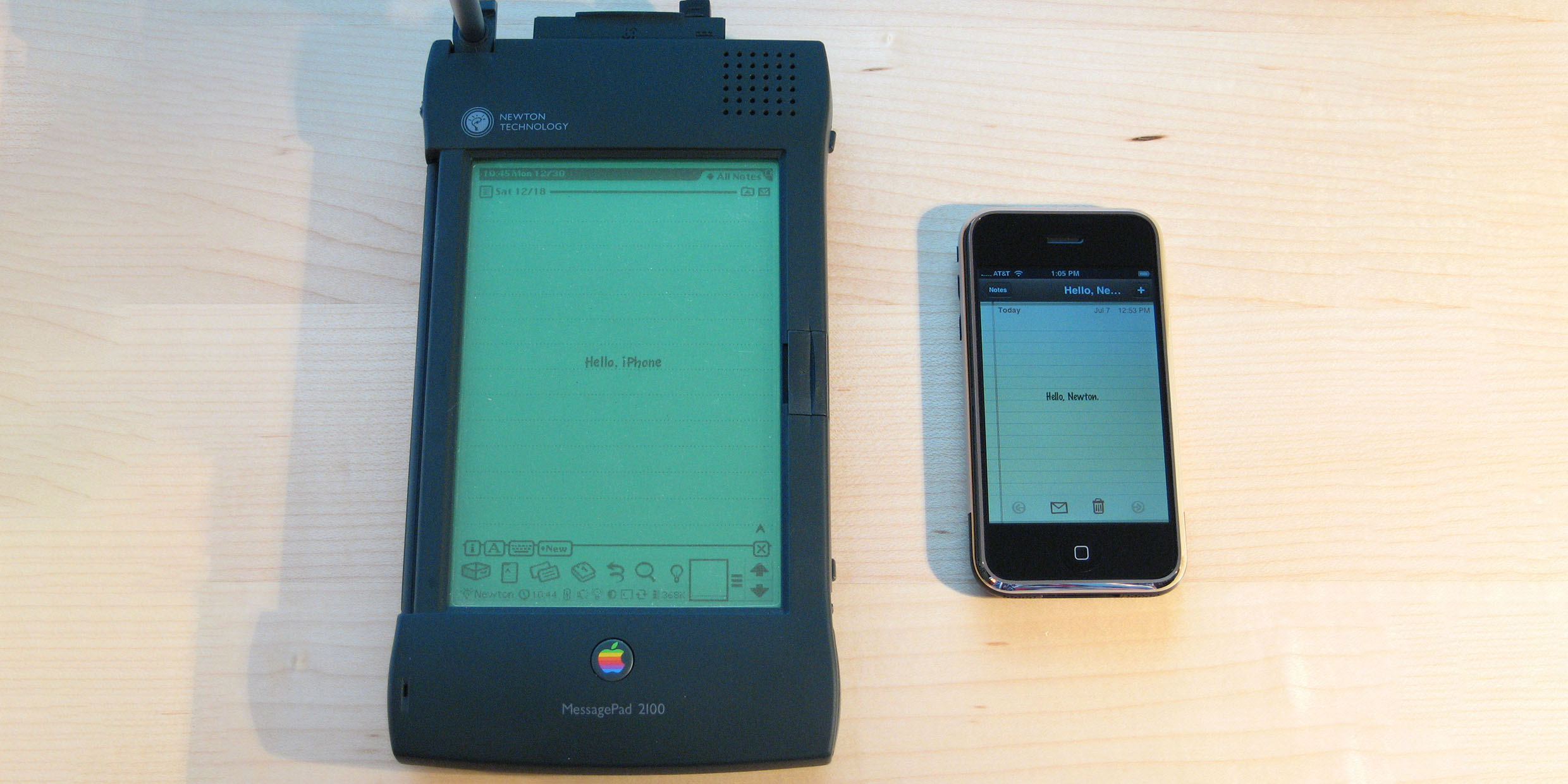 Image of a large Apple Newton next to a small Apple iPhone