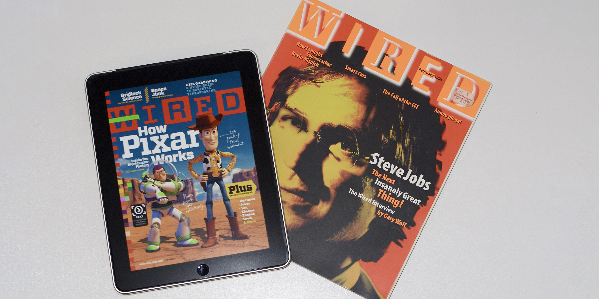 Image of the digital edition of Wired magazine displayed on an iPad next to a print edition of the magazine