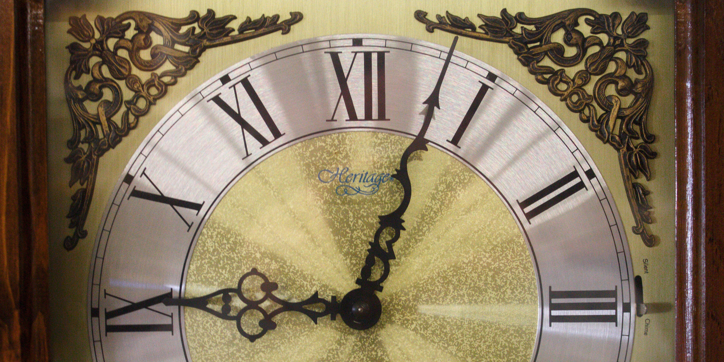 Close up image of the face of a grandfather clock