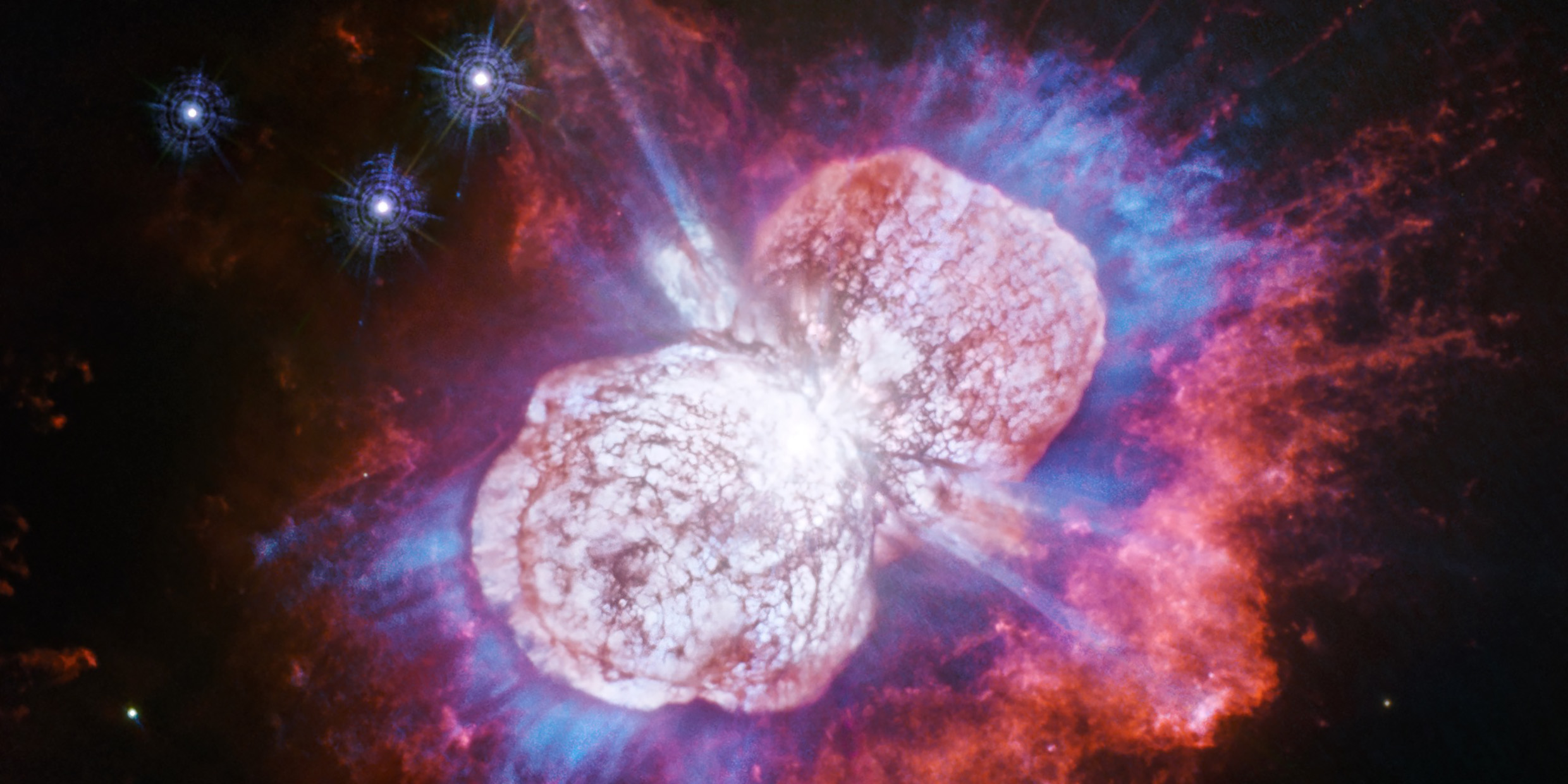 Astronomical image of glowing plumes of gas from a stellar explosion